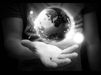 a man is holding a globe in his hand